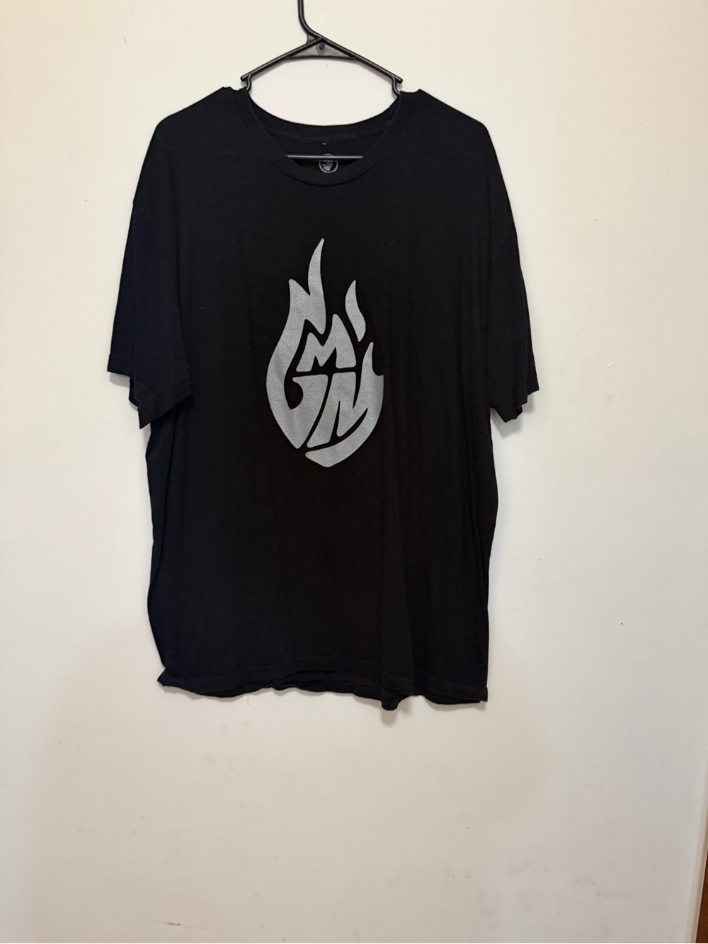 Black Short-Sleeve Graphic Tee with Silver Flame Emblem